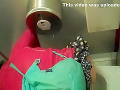 Woman in red jacket pissing