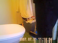 Woman taking a seat in toilet and peeing