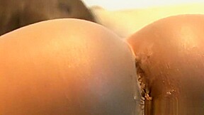 Young black TS spreading her ass in closeup
