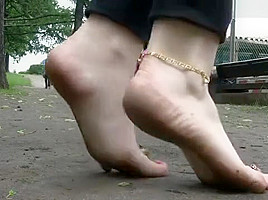 katya walking barefoot in public on a rainy day 3