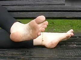katya walking barefoot in public on a rainy day 3