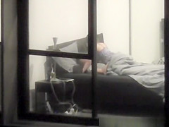 neighbor films apartment window