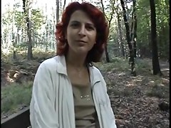 redhead wench receives exposed in the wood
