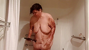 ugly, obese old lady, huge belly, nude shower with chocolate syrup