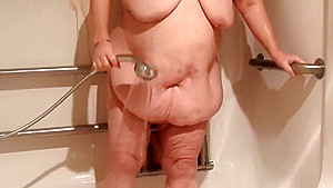 ugly, obese old lady, huge belly, nude shower with chocolate syrup